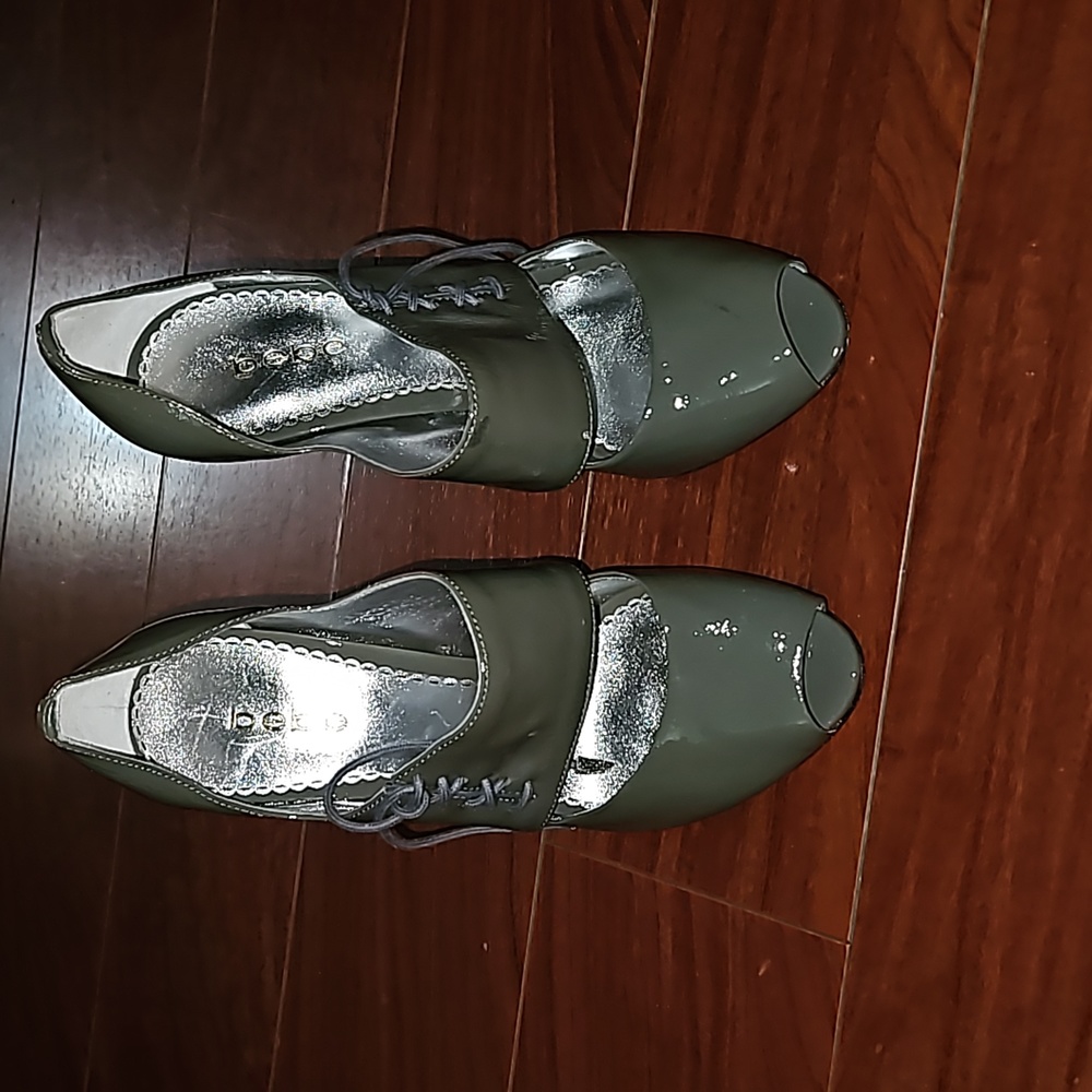Bebe gray, patent leather, and open toed pumps.